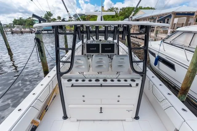 Slide: The Image of 2020 Contender 44 ST boat interior with blue LED lighting and advanced navigation screens. - 8