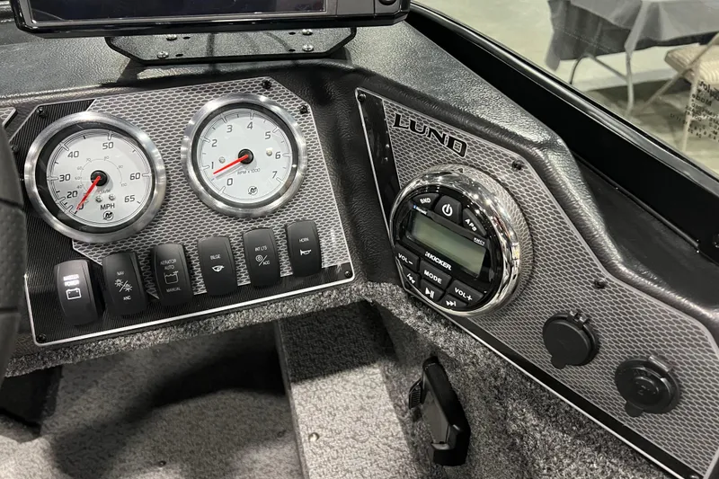 Slide: The Image of Dashboard of 2024 Lund 1650 Angler Sport boat with gauges and controls. - 10
