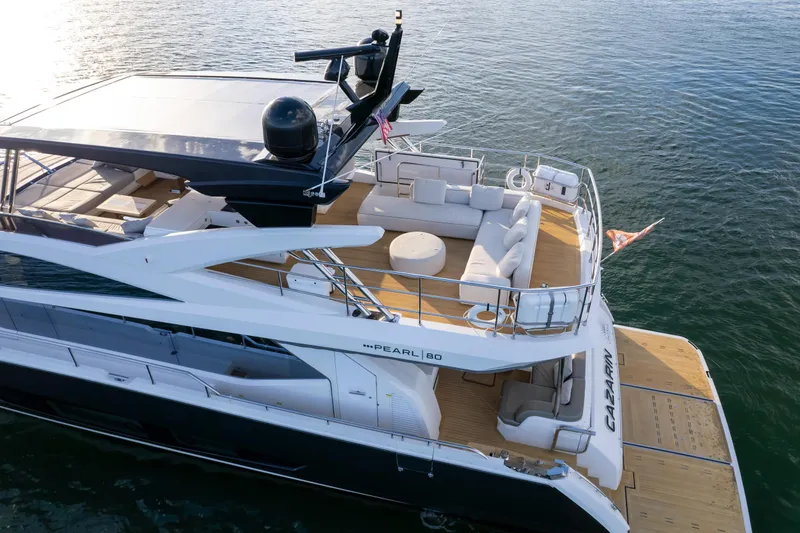 Slide: The Image of Luxurious 2020 Pearl 80 yacht with spacious deck and modern design on calm waters. - 12