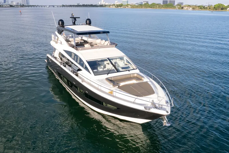 Slide: The Image of Luxurious 2020 Pearl 80 yacht cruising on calm blue waters. - 16