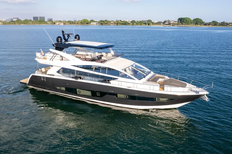 Slide: The Image of Luxurious 2020 Pearl 80 yacht cruising on serene blue waters. - 17