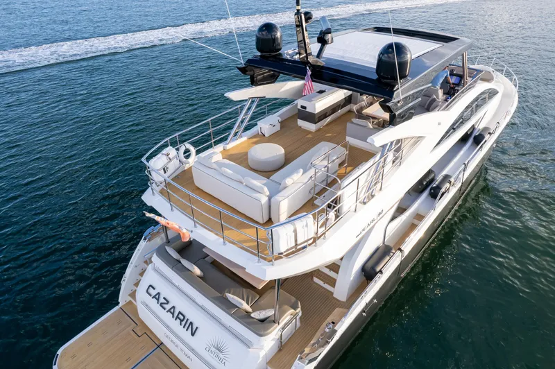 Slide: The Image of Luxurious 2020 Pearl 80 yacht cruising on open water, featuring spacious deck and modern design. - 2