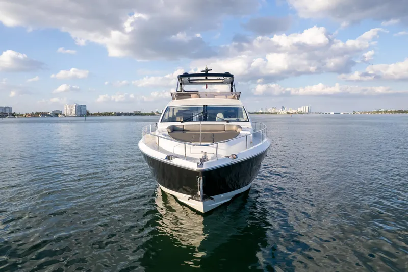 Slide: The Image of Luxurious Pearl 80 yacht on calm waters under a partly cloudy sky, 2020 model. - 26