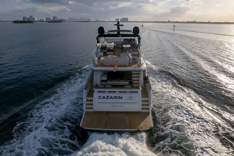 Slide: The Image of Luxurious Pearl 80 yacht cruising on open water at sunset, 2020 model. - 27
