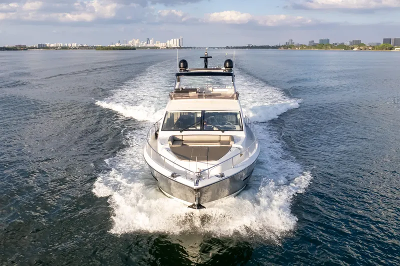 Slide: The Image of Luxurious 2020 Pearl 80 yacht cruising on open water under a partly cloudy sky. - 3