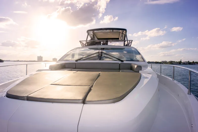 Slide: The Image of Luxurious 2020 Pearl 80 yacht on serene water at sunset. - 36