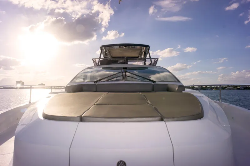 Slide: The Image of Luxurious 2020 Pearl 80 yacht on water at sunset, showcasing sleek design. - 37