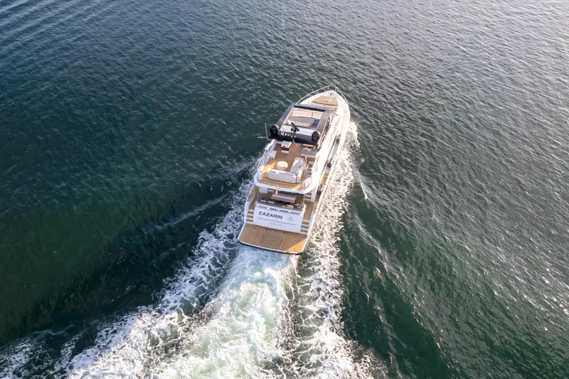 Slide: The Image of Aerial view of 2020 Pearl 80 yacht cruising on open water. - 4