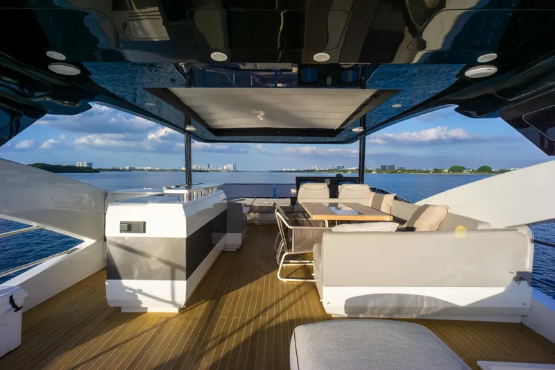 Slide: The Image of Luxurious Pearl 80 yacht deck with seating, ocean view, and modern design, 2020 model. - 44