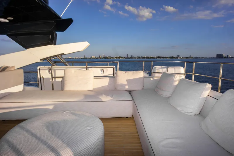 Slide: The Image of Luxurious Pearl 80 yacht deck with plush seating, overlooking serene ocean view. - 47