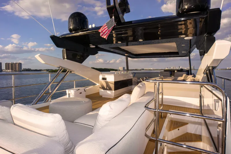 Slide: The Image of Luxurious 2020 Pearl 80 yacht deck with elegant seating and scenic ocean view. - 49