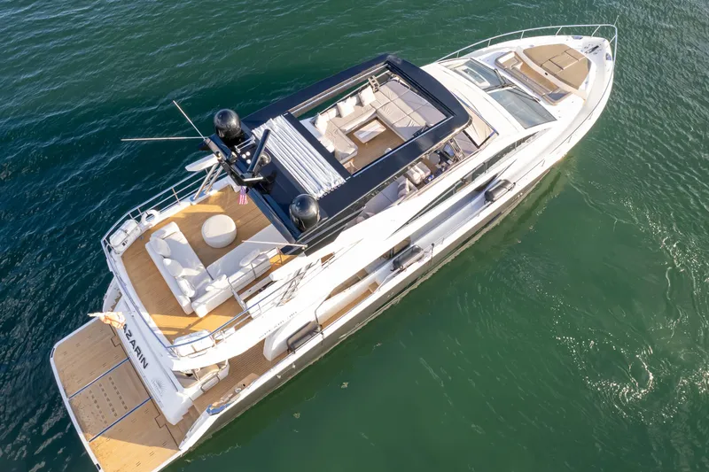 Slide: The Image of Luxurious 2020 Pearl 80 yacht cruising on clear blue water. - 7
