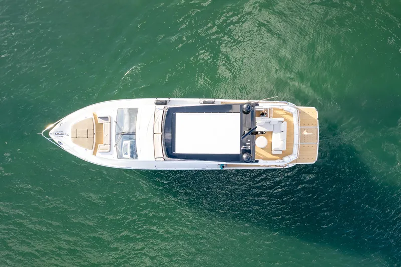 Slide: The Image of Aerial view of 2020 Pearl 80 yacht on green water. - 9