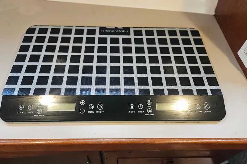 Slide: The Image of KitchenRaku induction cooktop with digital controls on Albin 34 Cruiser, 1988 model. - 14