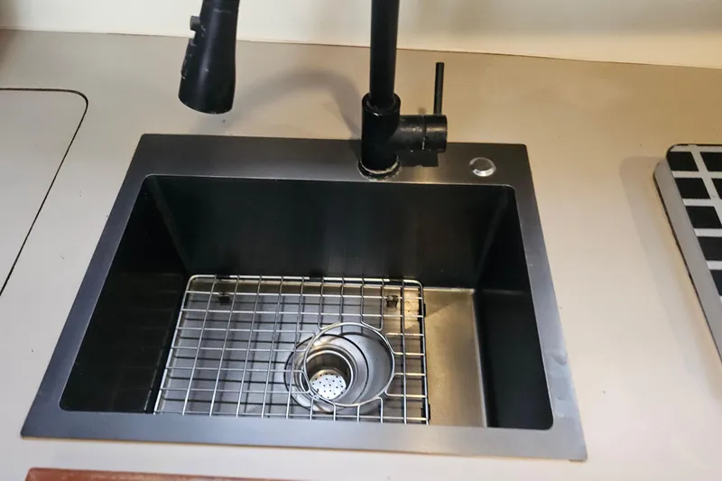 Slide: The Image of Stainless steel sink with modern faucet in 1988 Albin 34 Cruiser boat kitchen. - 43