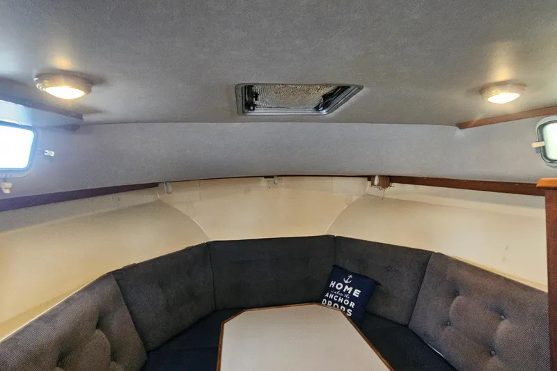 Slide: The Image of Interior of 1988 Albin 34 Cruiser with cozy seating and nautical decor. - 46