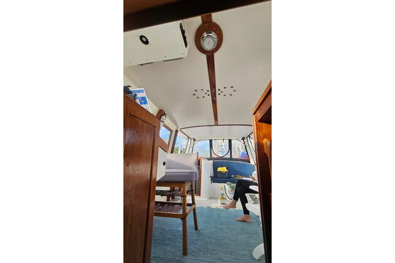 Slide: The Image of Interior of 1988 Albin 34 Cruiser with wooden accents and blue carpet. - 53