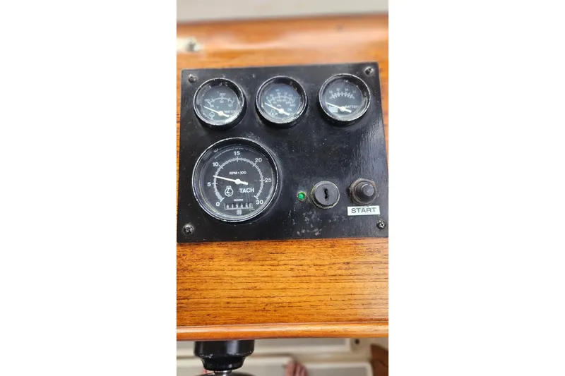 Slide: The Image of Instrument panel of a 1988 Albin 34 Cruiser with tachometer and gauges. - 61