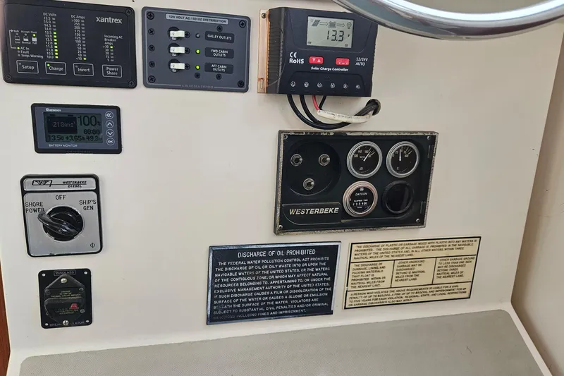 Slide: The Image of Control panel of a 1988 Albin 34 Cruiser with various gauges and switches. - 62