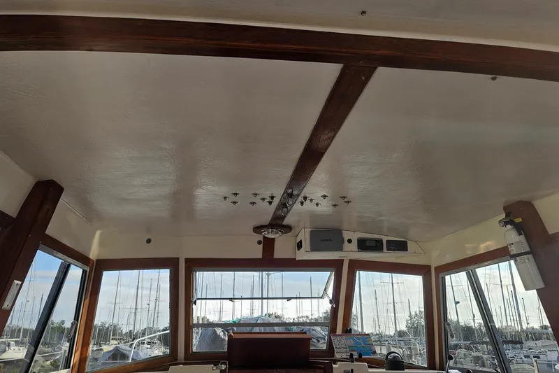 Slide: The Image of Interior view of 1988 Albin 34 Cruiser helm with windows and equipment. - 66