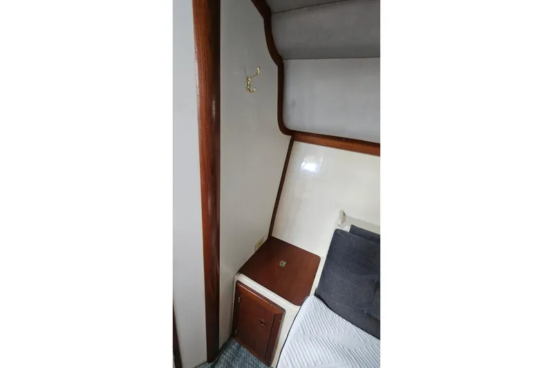 Slide: The Image of 1988 Albin 34 Cruiser interior with wood accents and cozy cabin space. - 71