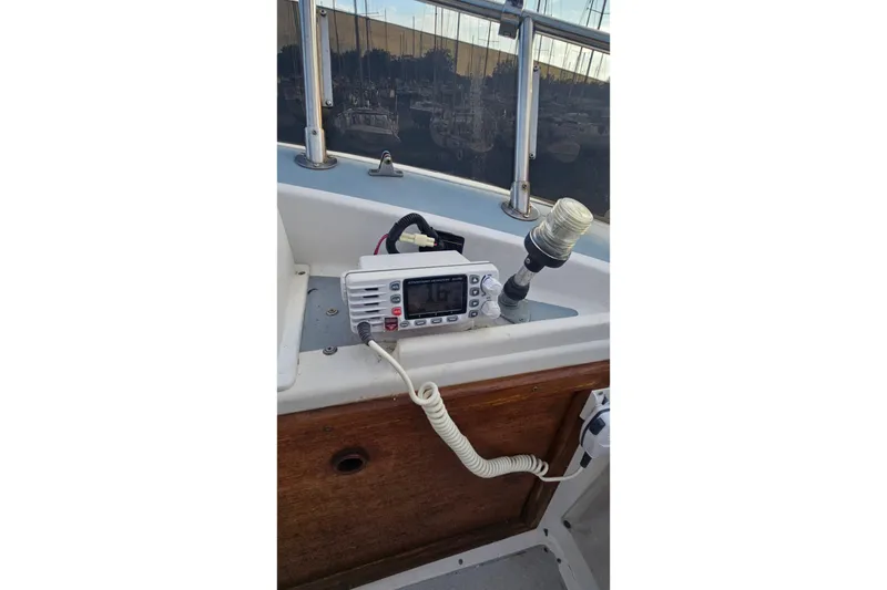 Slide: The Image of VHF radio and light fixture on 1988 Albin 34 Cruiser boat deck. - 78