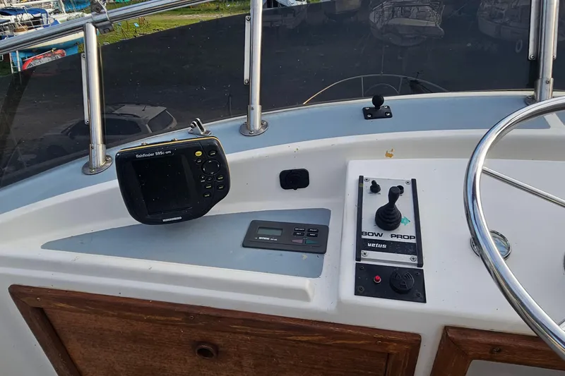 Slide: The Image of Control panel of a 1988 Albin 34 Cruiser with fishfinder and joystick. - 80