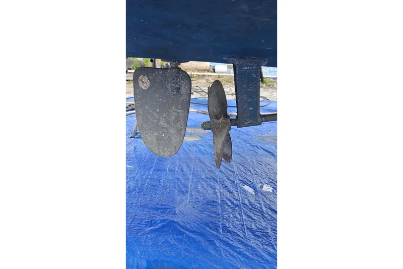Slide: The Image of Propeller and rudder of 1988 Albin 34 Cruiser on blue tarp. - 84
