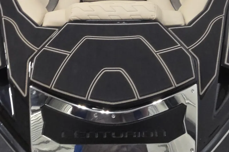 Slide: The Image of 2026 Centurion R1245 boat interior with sleek black and beige design. - 10