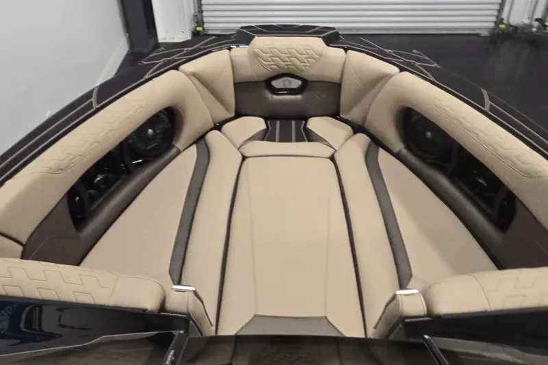 Slide: The Image of Luxurious interior of 2026 Centurion R1245 boat with beige and black seating. - 13