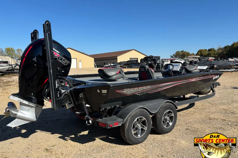 Slide: The Image of 2021 Ranger RT198P boat with trailer, parked outdoors at D&R Sports Center. - 2