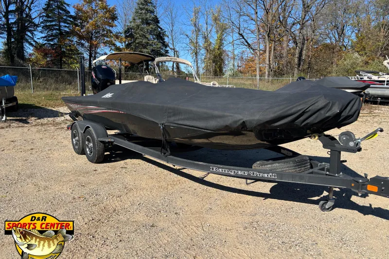 Slide: The Image of 2021 Ranger RT198P boat on trailer with cover, parked outdoors. - 5
