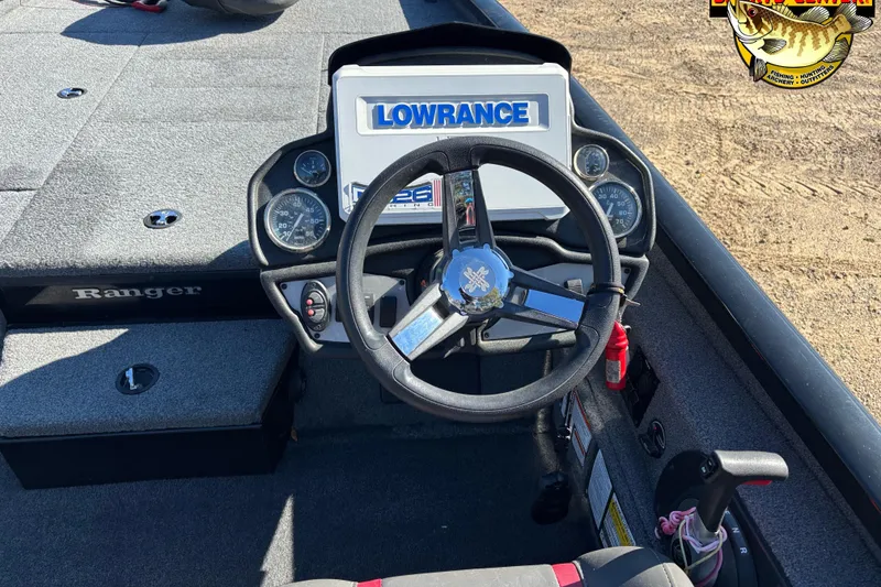 Slide: The Image of 2021 Ranger RT198P boat dashboard with Lowrance display and steering wheel. - 8
