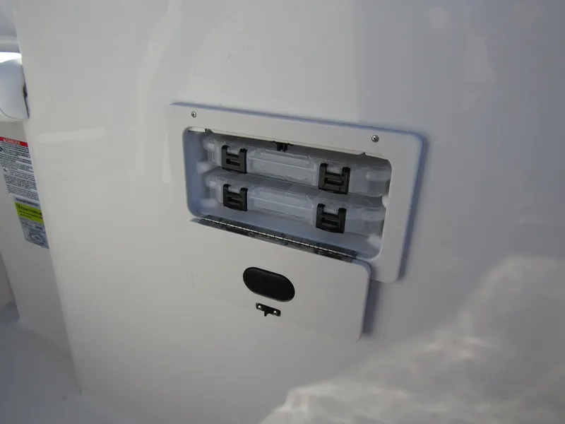 Slide: The Image of 2024 Starcraft SVX 231 OB CC boat interior detail with safety labels. - 17