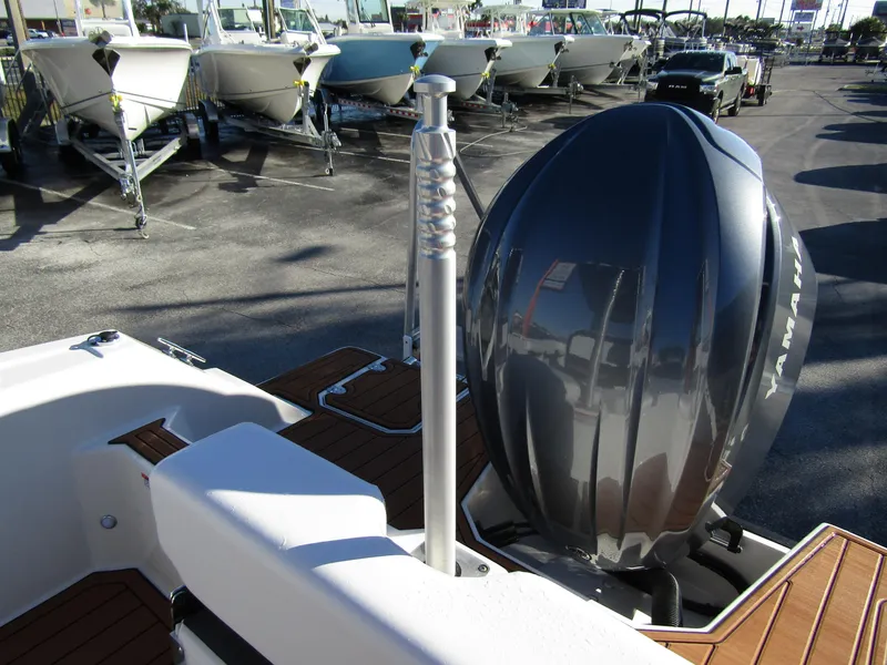 Slide: The Image of 2024 Starcraft SVX 231 OB CC boat deck with storage compartment and cup holders. - 27