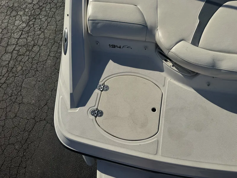 Slide: The Image of 2009 Monterey 194FS boat interior with seating and storage compartment. - 11