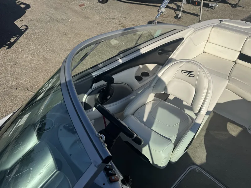 Slide: The Image of 2009 Monterey 194FS boat interior with steering wheel and seating. - 20