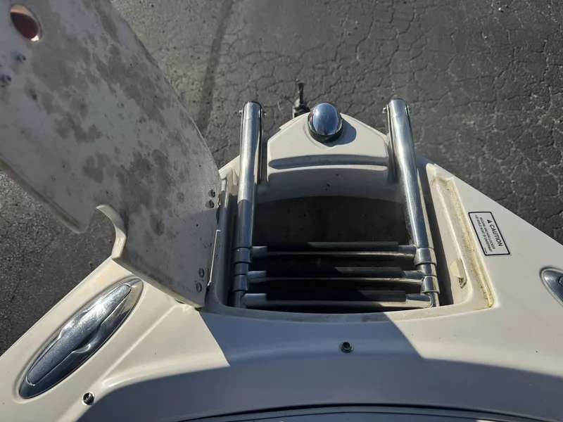 Slide: The Image of 2009 Monterey 194FS boat ladder and hatch on asphalt background. - 27