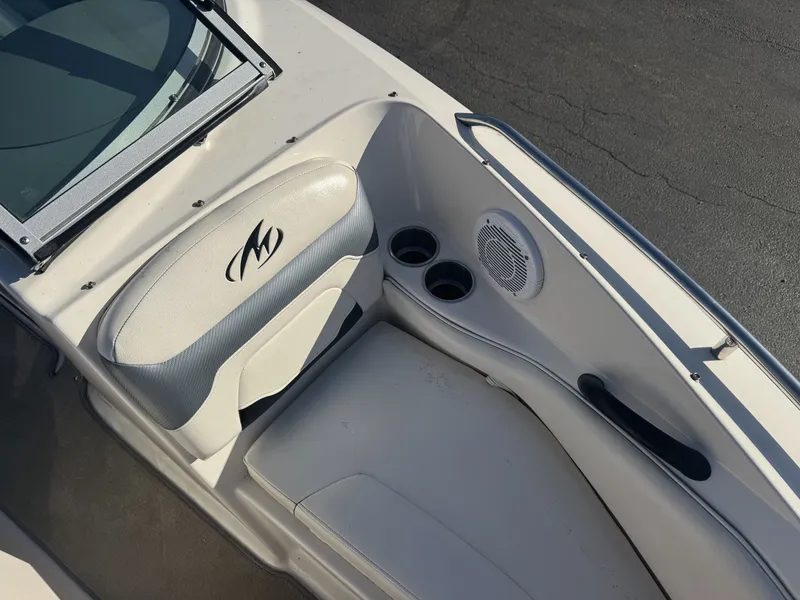 Slide: The Image of Interior of a 2009 Monterey 194FS boat with seating and cup holders. - 29