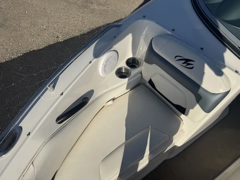 Slide: The Image of 2009 Monterey 194FS boat interior with seating, cup holders, and speaker. - 30