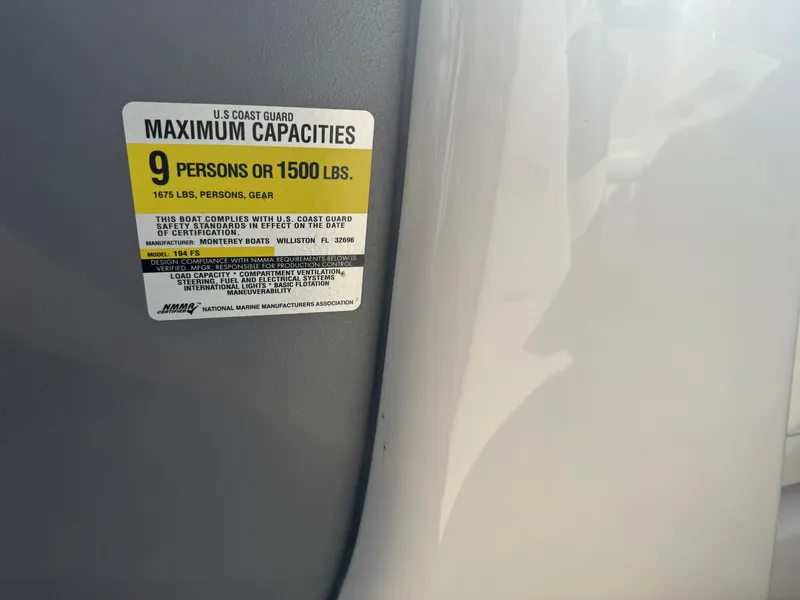 Slide: The Image of 2009 Monterey 194FS capacity label, 9 persons or 1500 lbs, U.S. Coast Guard compliant. - 34