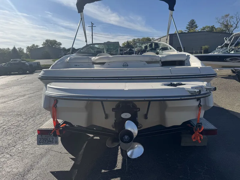 Slide: The Image of Rear view of a 2009 Monterey 194FS boat on a trailer in a parking lot. - 8
