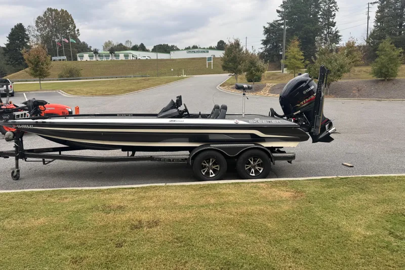 Slide: The Image of 2019 Skeeter ZX250 boat on trailer, parked outdoors with Yamaha engine. - 10