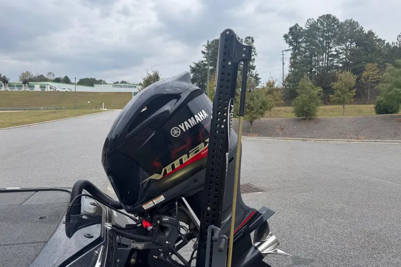 Slide: The Image of 2019 Skeeter ZX250 with Yamaha VMAX engine, parked outdoors on a cloudy day. - 12