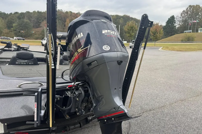 Slide: The Image of 2019 Skeeter ZX250 boat with Yamaha 250 engine in a parking lot. - 13
