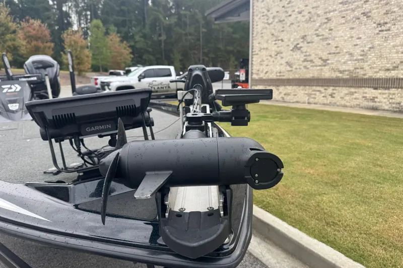 Slide: The Image of 2019 Skeeter ZX250 boat with Garmin electronics, parked near a brick building. - 6