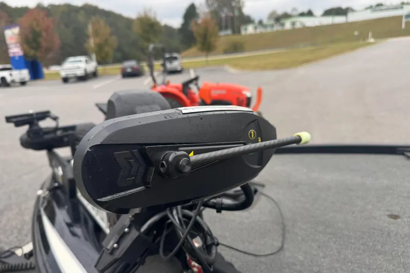 Slide: The Image of Close-up of a 2019 Skeeter ZX250 boat component in a parking lot. - 8