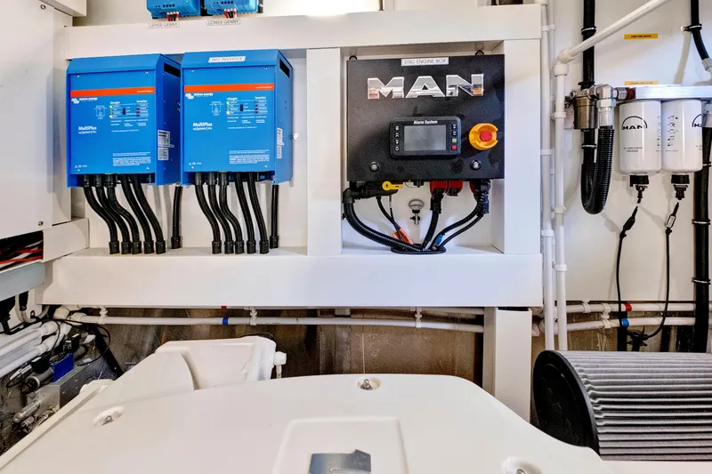 Slide: The Image of Engine room of 2024 Sunseeker 76 Yacht with MAN control panel and electrical systems. - 103