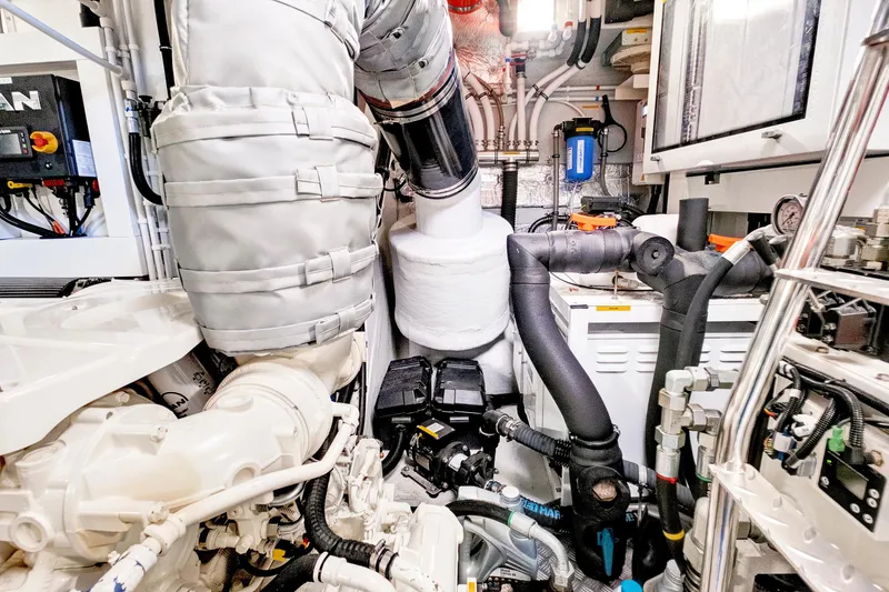 Slide: The Image of Engine room of 2024 Sunseeker 76 Yacht, showcasing advanced mechanical systems and components. - 104