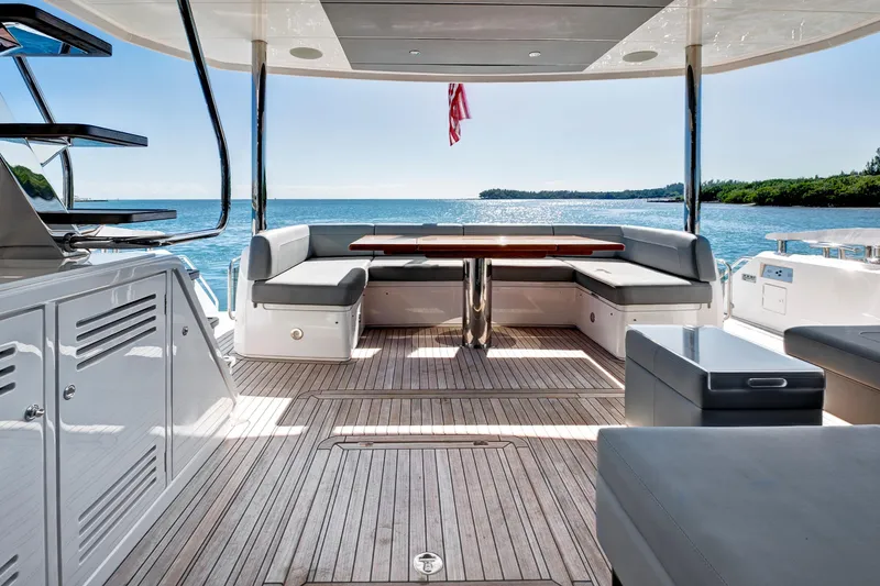 Slide: The Image of Luxurious 2024 Sunseeker 76 Yacht deck with elegant seating and ocean view. - 13